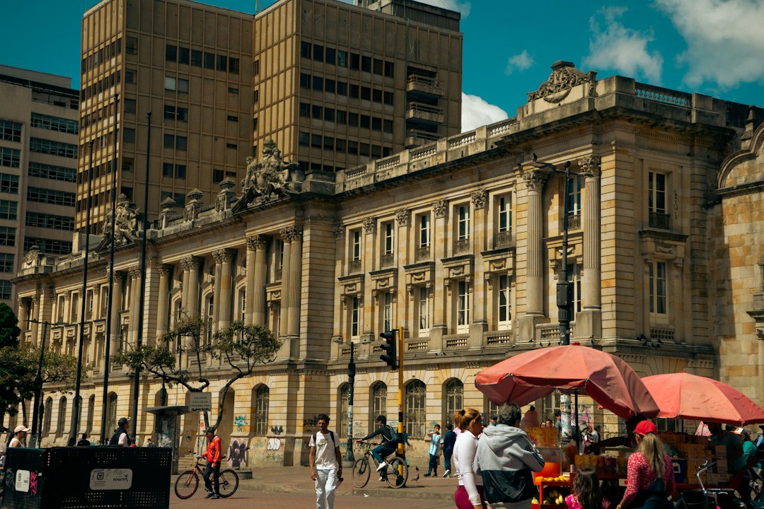 Group of people standing in front of a large building in Colombia